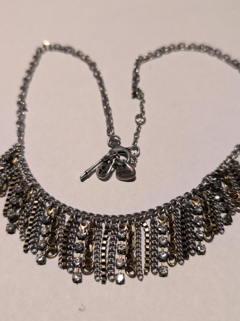 Fossil silver and gold necklace with fringe detail & charms #boho #festival